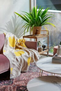 Interior with textiles featuring pattern designs by Saara Obele