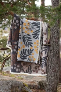 Pihapuu blanket by Saara Obele for Lapuan Kankurit, photographed outdoors