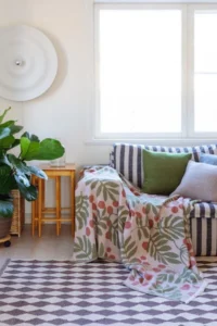 Pihapuu blanket designed by Saara Obele for Lapuan Kankurit in a living room interior
